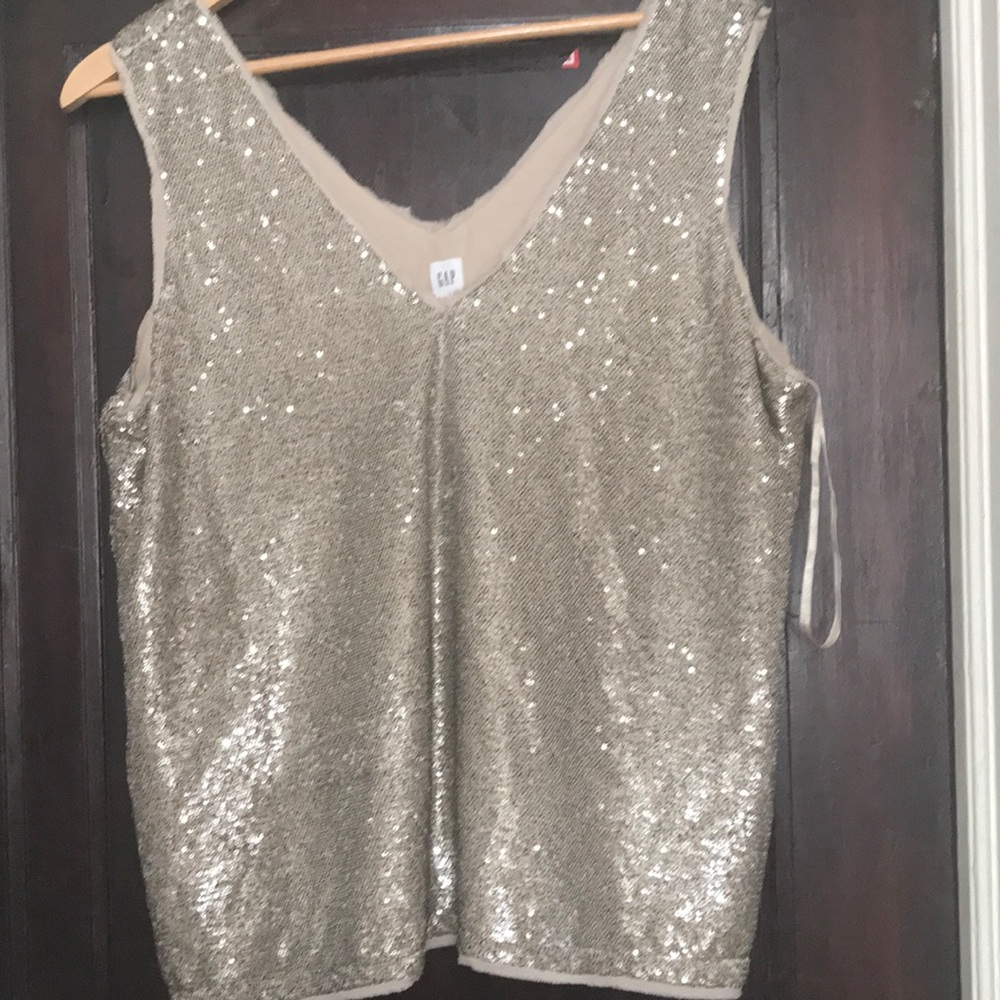 29.  New with tags, strapless top with pale gold sequins.